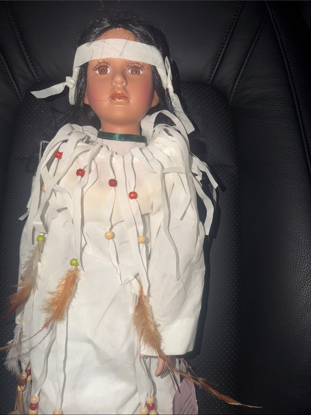 Handcrafted White Feather-Trimmed Doll with Beaded Accents